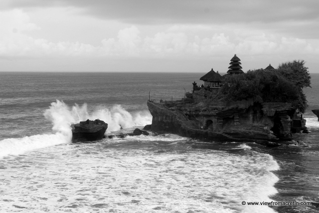 Waves explode against mystical Tanah Lot.